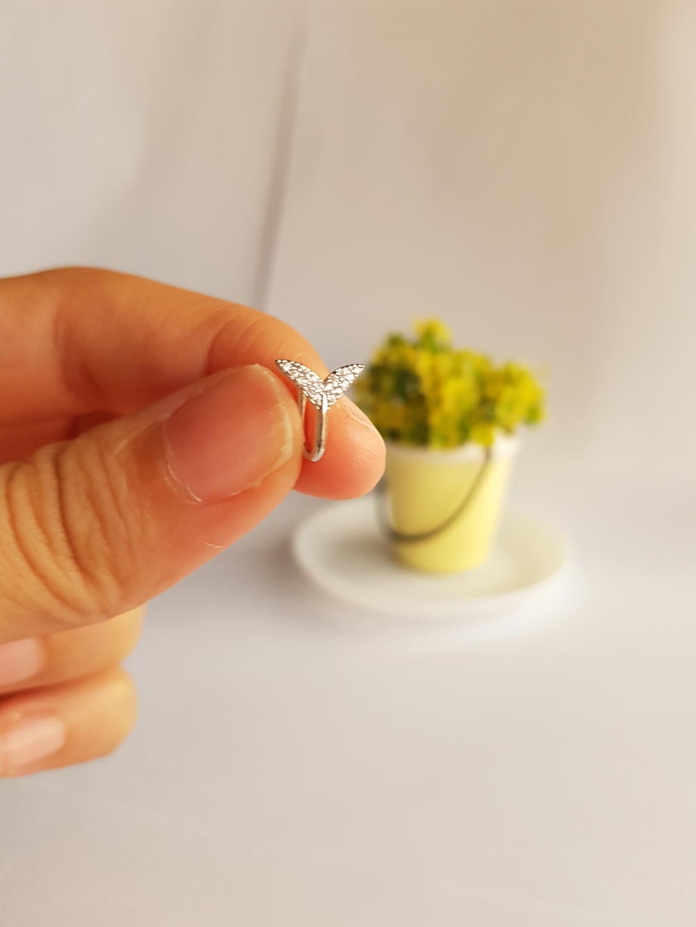 حلق انف ذيل السمكة (قطعة واحدة) (NR1) Fish tail fake nose ring Preview Image