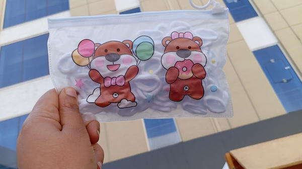 hair ties/bag of mini white hair ties شنطة توك استك صغيرة Image 3 Preview